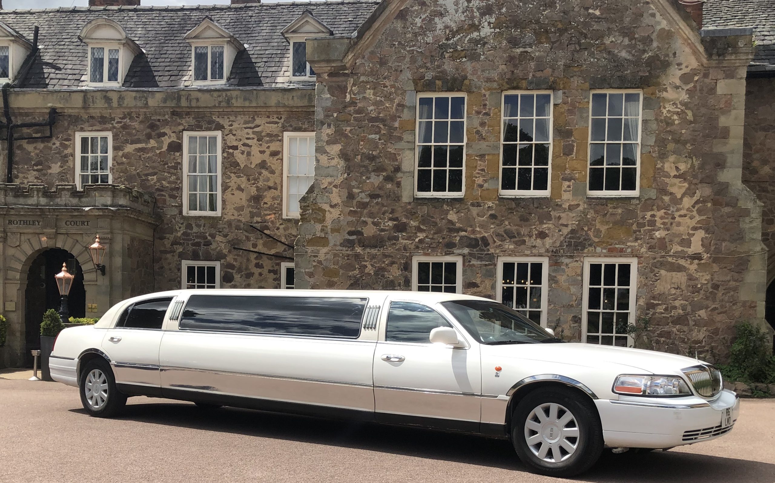 Watford Lincoln Town car beside park